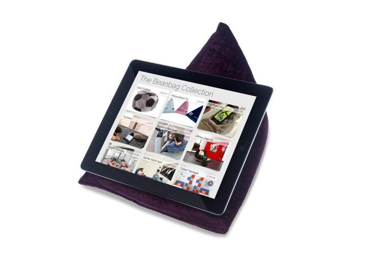 Purple triangular book pillow. An ereader sits on the holder. Link: https://images-na.ssl-images-amazon.com/images/I/81MTh1uk%2BFL._AC_SL1500_.jpg