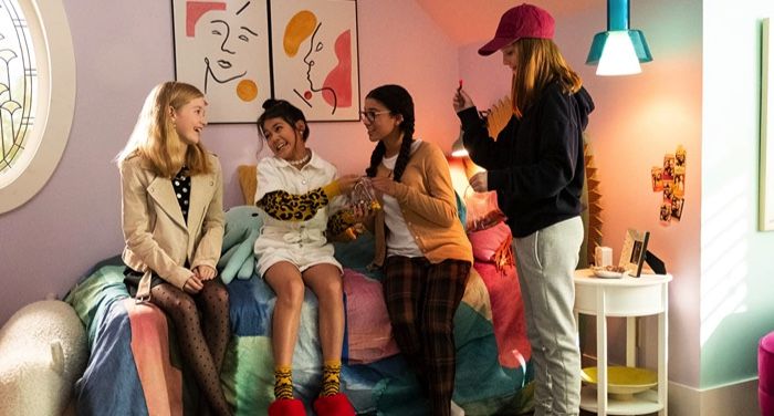 a still from the baby-sitters club netflix series showing the baby-sitters laughing together