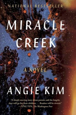 cover image of Miracle Creek by Angie Kim; photo of night sky covered in stars as seen from the forest floor