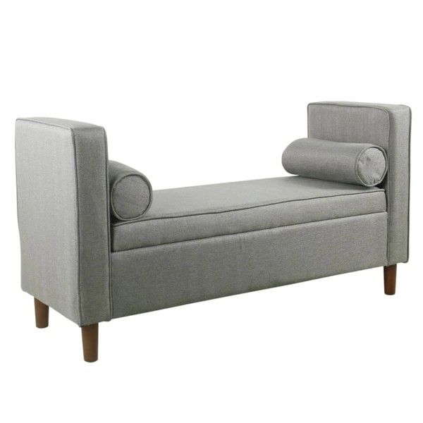 grey upholstered bench with pillows