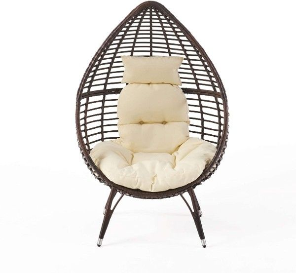 brown teardrop wicker chair with cushions