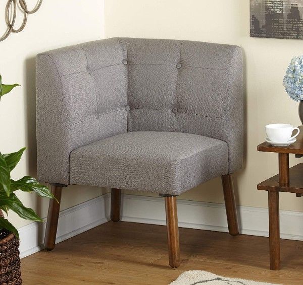 grey corner chair with low back and wood legs