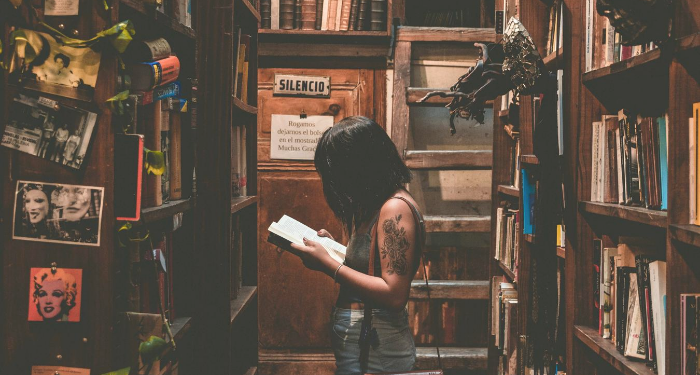 woman reading in a bookstore