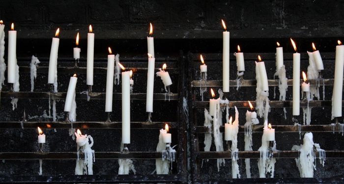 a host of candles burning