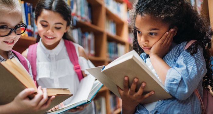 children reading books in the library