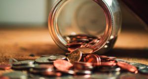 coins spilling out of a jar