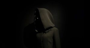 image of a person wearing a black hoodie against a black background https://unsplash.com/photos/uGBIhxZ4zoE