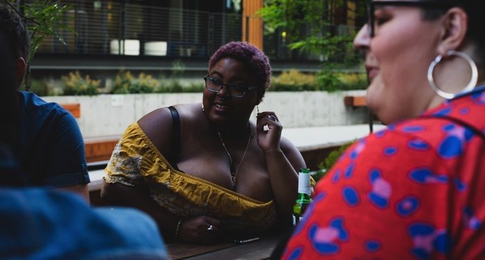 Black plus size woman in summer outfit https://unsplash.com/photos/ZSMwf9UKhG0