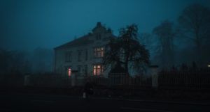 a photo of a haunted house at night