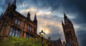 image of a spired building on a college campus at dusk