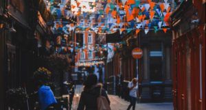 image of a woman walking down a street in Dublin, Ireland https://unsplash.com/photos/POQHijPTjIA