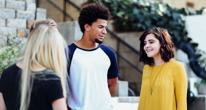 a group of young people standing around