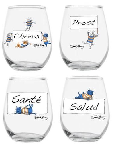 Four stemless wine glasses with a word for cheers on each glass in different languages accompanied by mischievous cats.