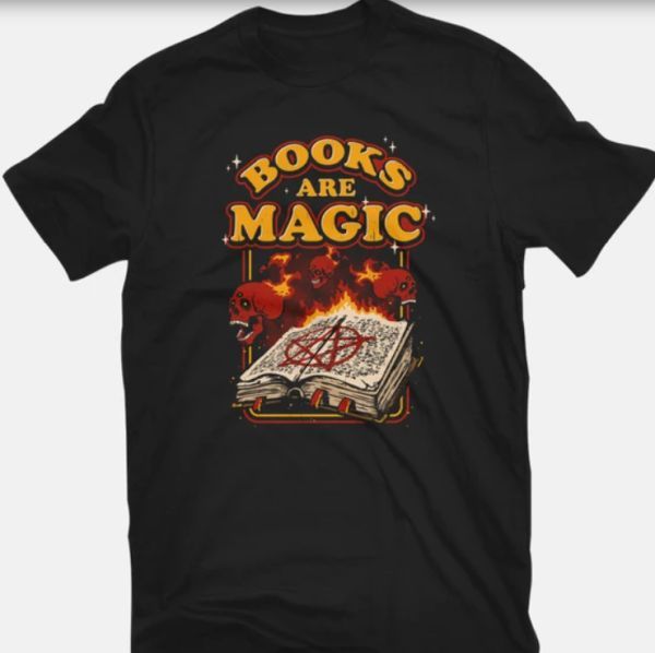 Books Are Magic T-shirt - TeeFury - image of open book of spells surrounded by flying, flaming skulls with text arced above