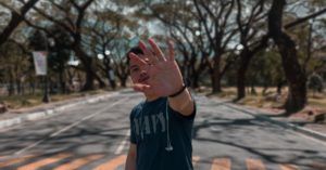 filipino man with hand raised for filipinx feature