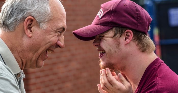 man with down syndrome laughing