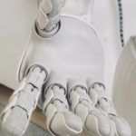 robot with its hand outstretched for robots and AI feature
