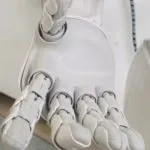 robot with its hand outstretched for robots and AI feature