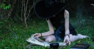 witch reading a book about witchcraft