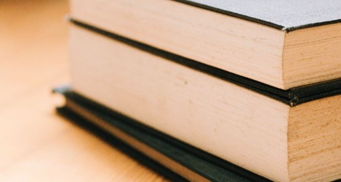 https://www.pexels.com/photo/hardbound-books-on-brown-wooden-table-4069089/