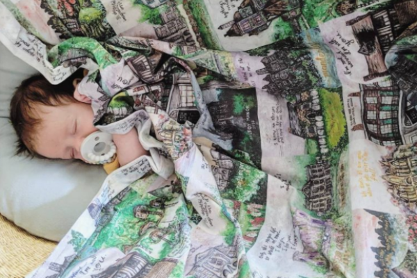 Literary Swaddling Blanket from Bookish Baby Shower Gift Ideas | bookriot.com