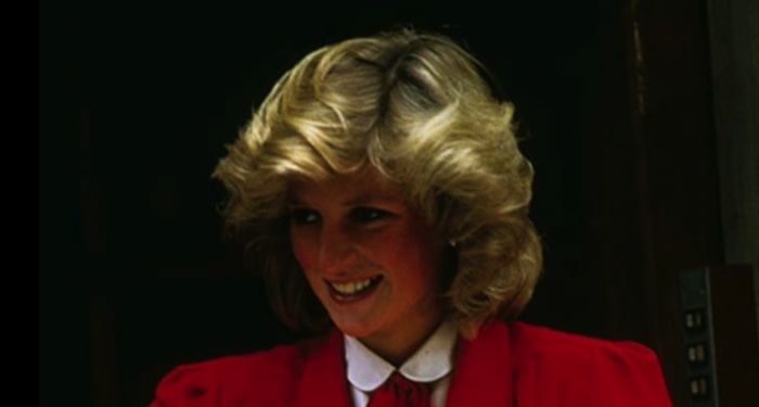 image of Princess Diana in a red suit https://www.imdb.com/name/nm0697740/mediaviewer/rm597604352/
