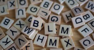 image of scattered letter tiles in a word game https://unsplash.com/photos/C5SUkYZT7nU