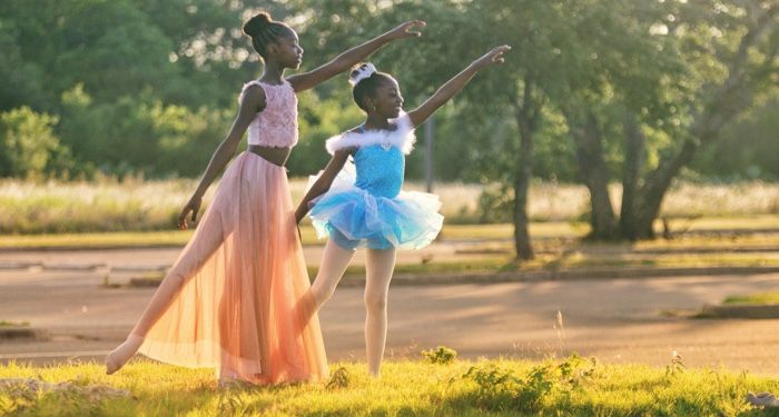 young dancers dancing ballet outdoors