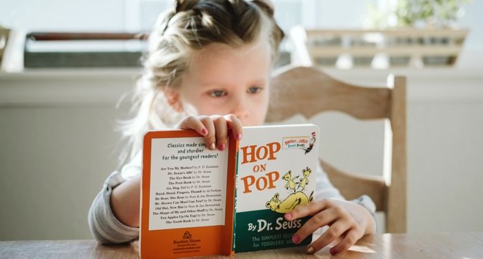 child reading dr seuss book