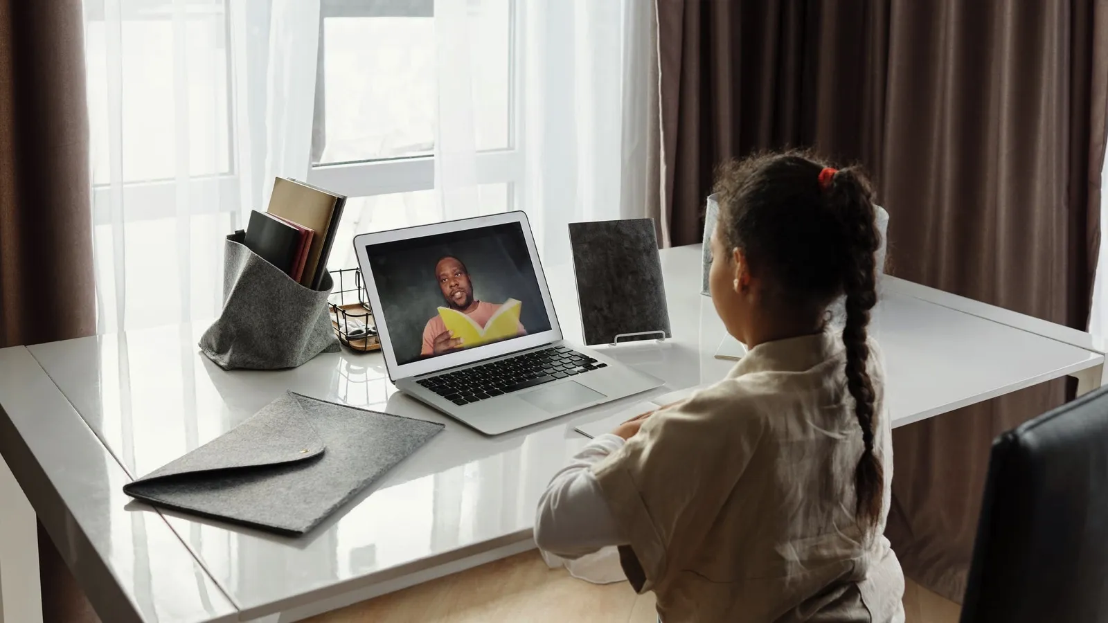 image of a young girl taking online class / remote learning https://www.pexels.com/photo/little-girl-taking-online-classes-4261789/
