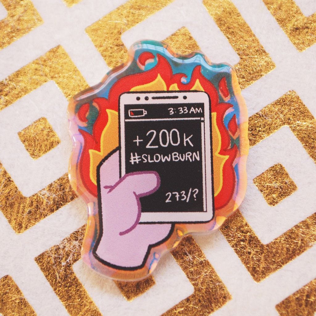 Acrylic pin showing a screen reading 200K slowburn