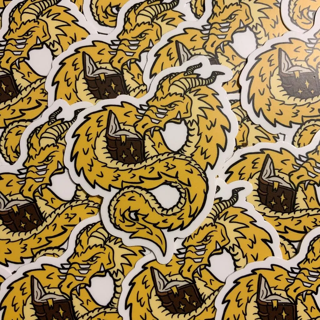 A dragon reading sticker
