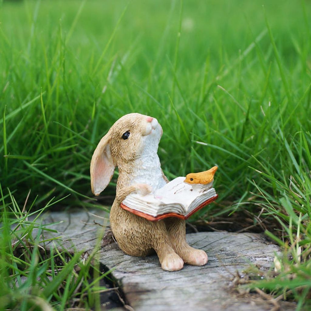 Rabbit reading book figurine