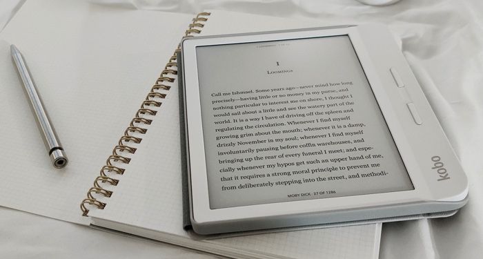 Kobo ereader on top of journal with stylus for reading ebooks feature
