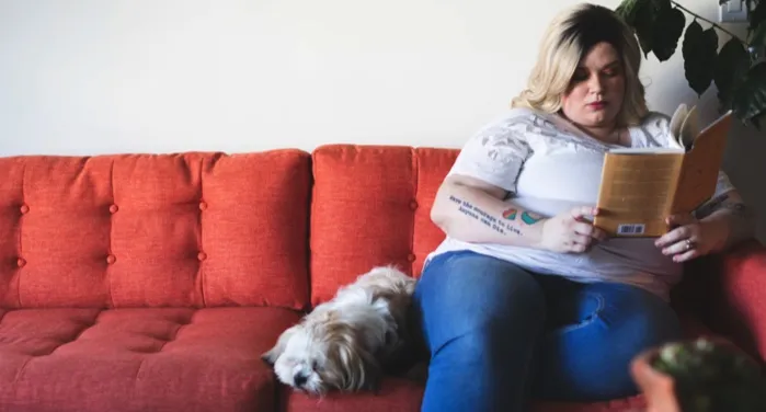 image of a plus size woman reading on a sofa https://unsplash.com/photos/0vK5u6_0Z7E