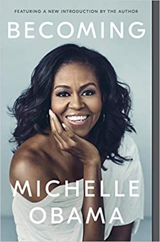 cover of Becoming by Michelle Obama; photo of the author in an off-the-shoulder white dress