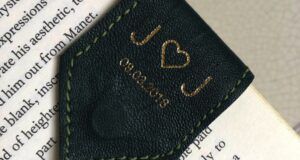 a personalized green leather bookmark