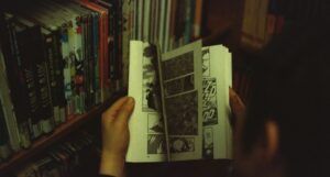 image of a child holding a comic book https://unsplash.com/photos/BfGuQJpDolQ