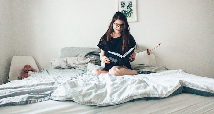 Woman reading in bed