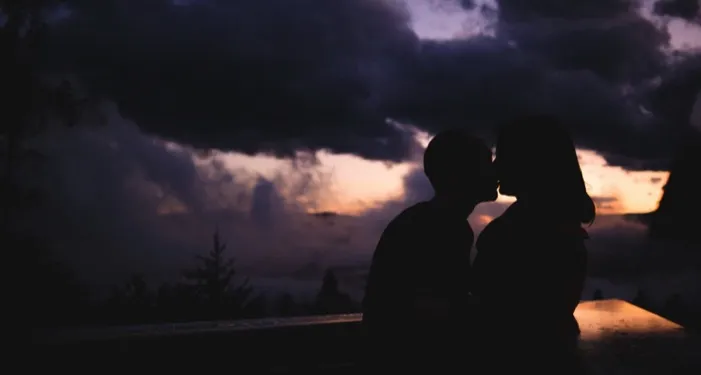 image of couple in silhouette kissing at sunset https://unsplash.com/photos/y_GZeVrdl-o