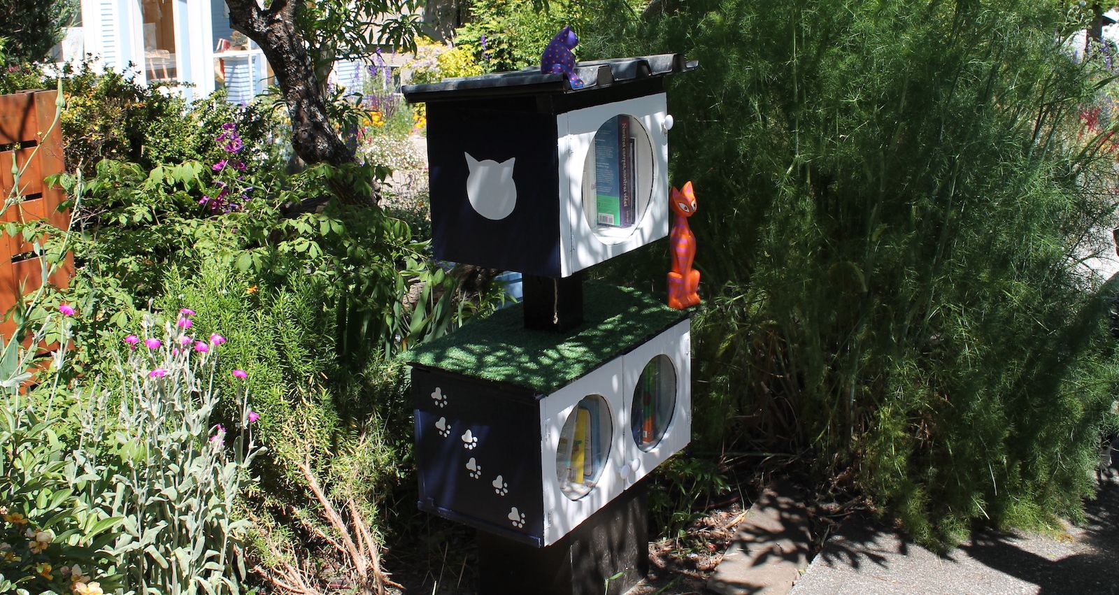 Little Free Library with cat figurines