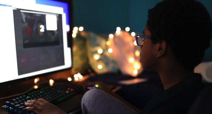 a child using a desktop computer https://unsplash.com/photos/zc9pWsPZd4Y