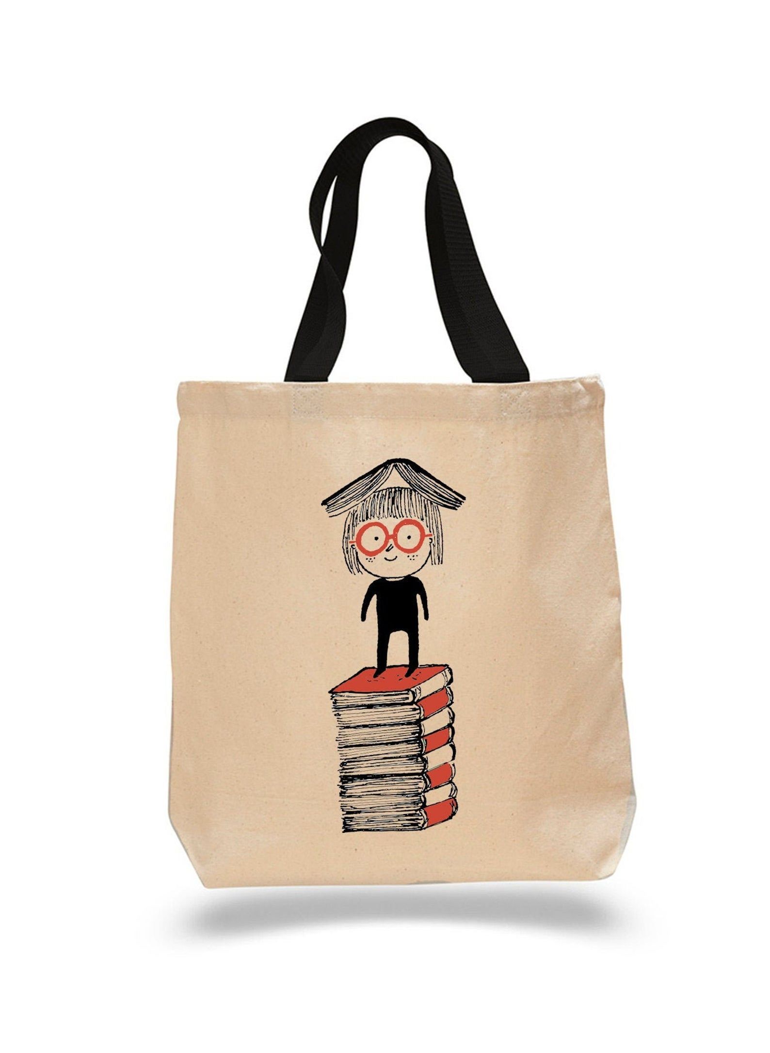 Tote bag with a cartoon figure balancing a book on their head