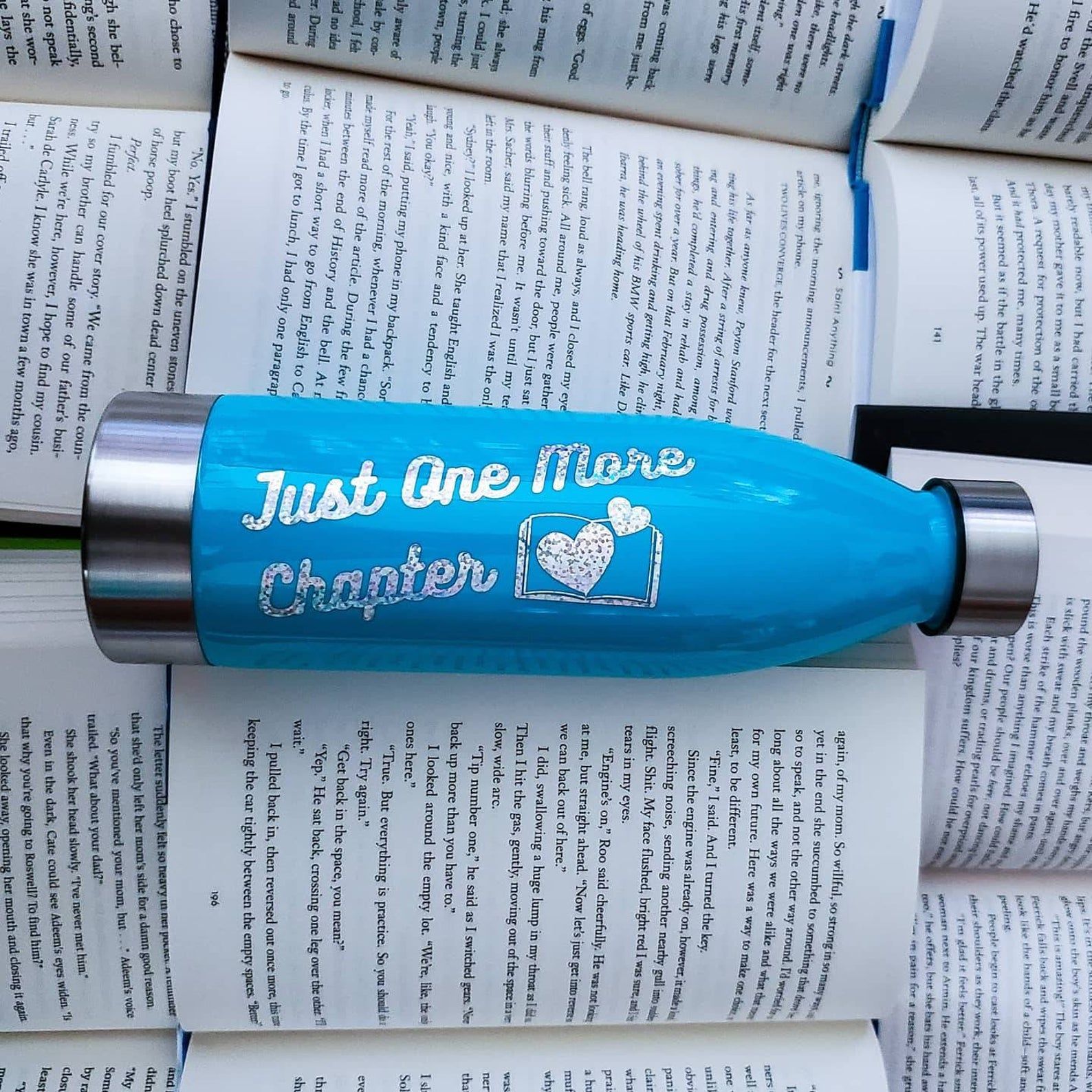 Water bottle with "Just One More Chapter" text