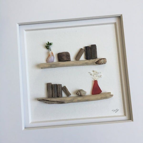 pebble and driftwood art bookshelf