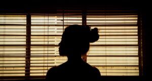 silhouette of a woman standing in front of a window https://unsplash.com/photos/vVINLKZtGOI