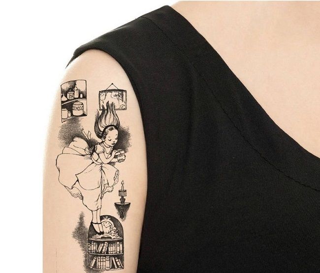 Image of large temporary tattoo of Alice falling down the rabbit hole on a person’s bicep