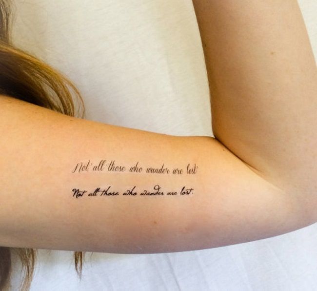 Not all who wander are lost Quote Temporary Tattoos On A Person's Bicep