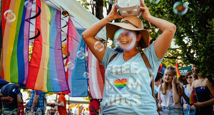 Pride photo of smiling person with bubble machine