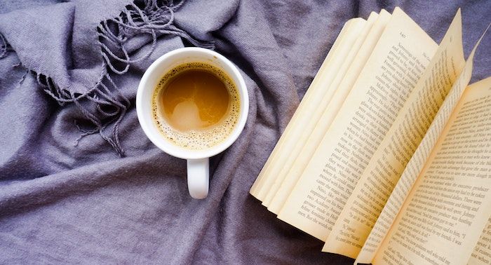 open book next to a coffee mug https://unsplash.com/photos/kRhISEQKWjI